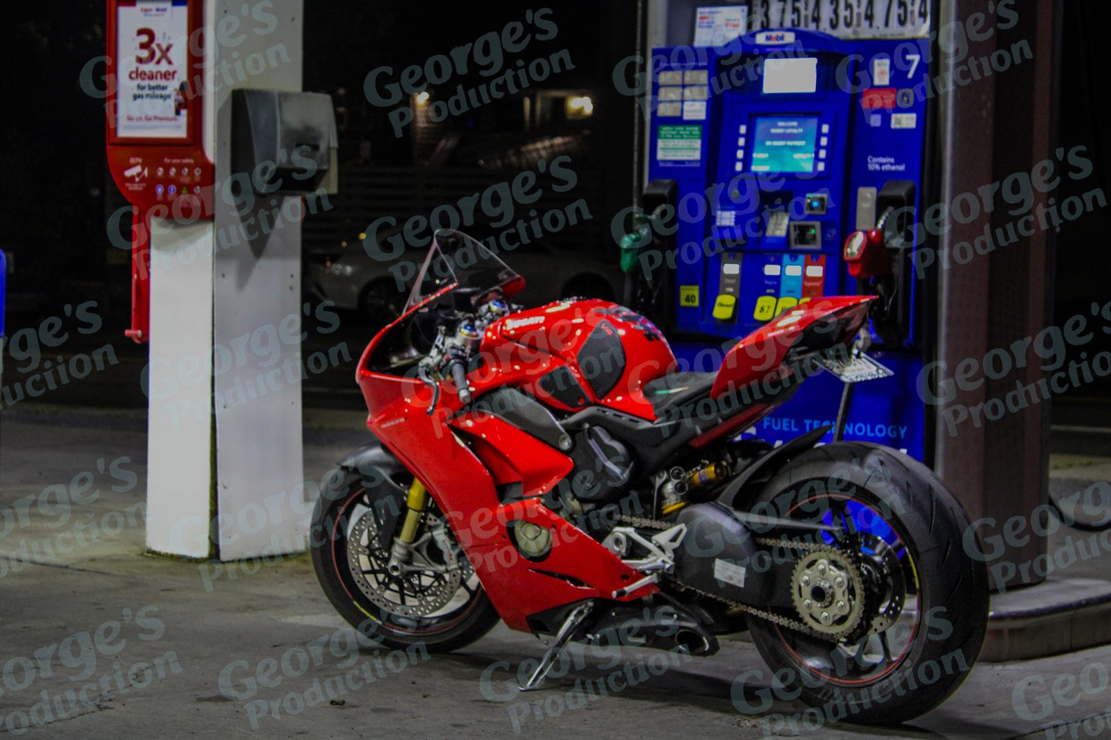 Motorcycle at a gas station at night