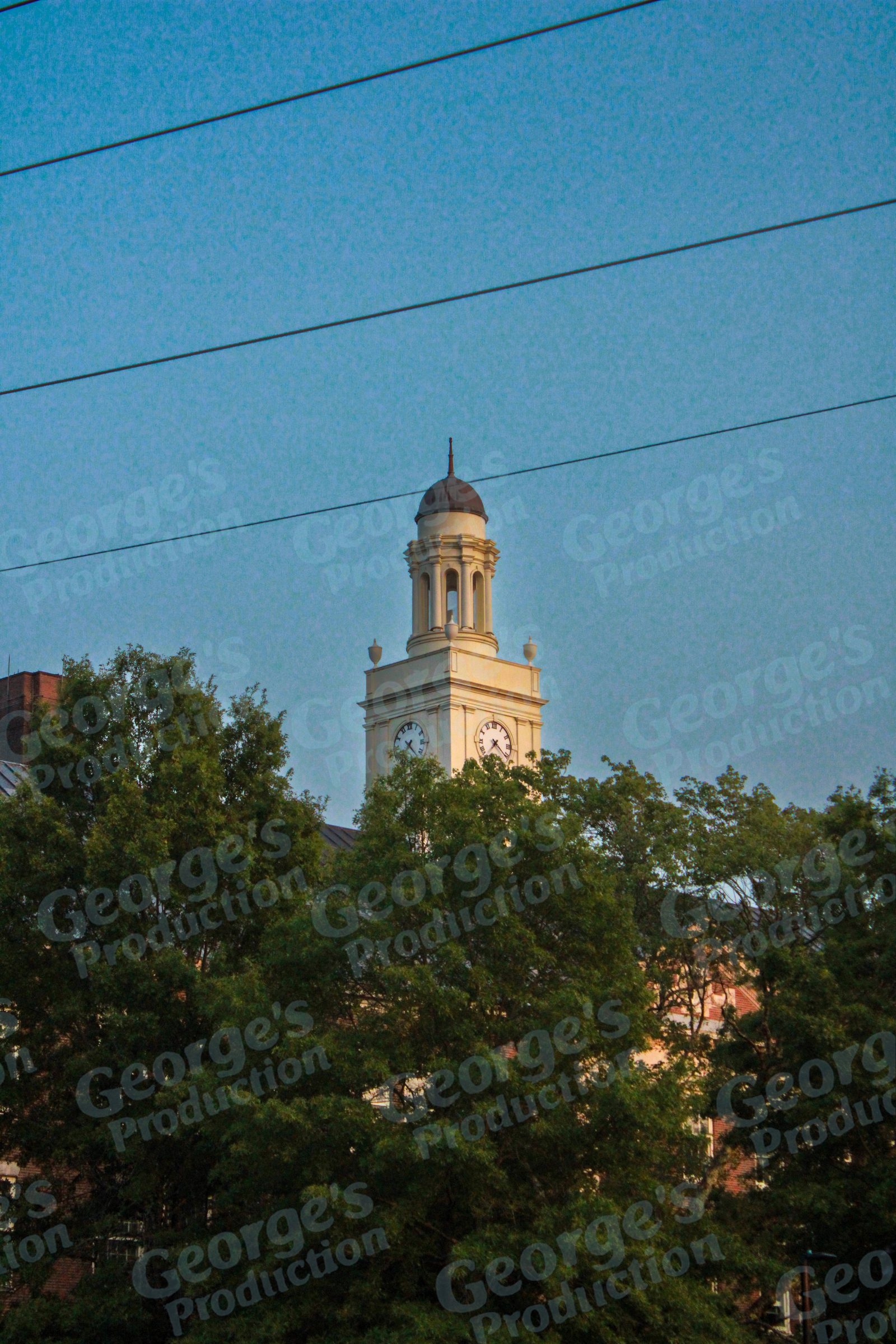 Historic clock tower at sunset